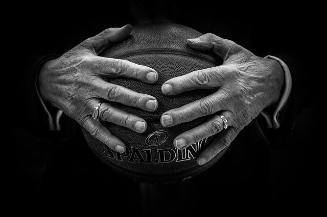 NBA basketball held by hands